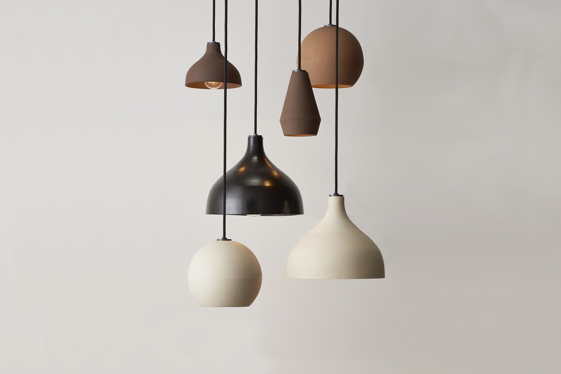 Lighting and furniture shaped through material honesty, restraint, and quiet utility.