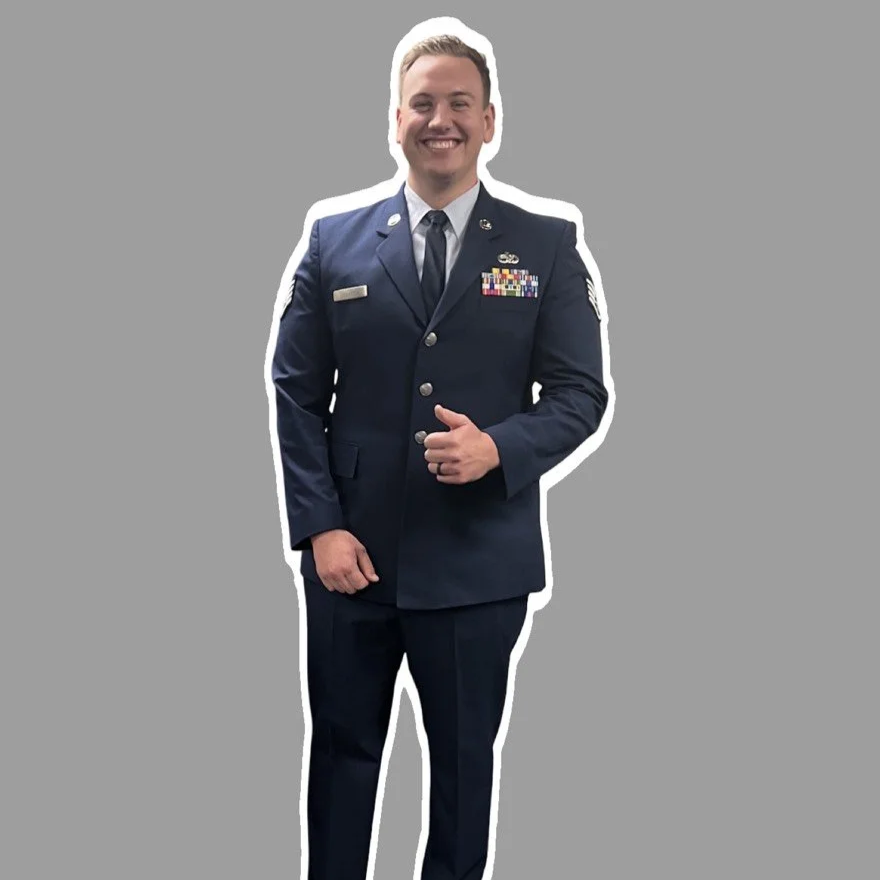 dress blues uniform badge and rack aligner smiling and giving a thumbs up, SSgt