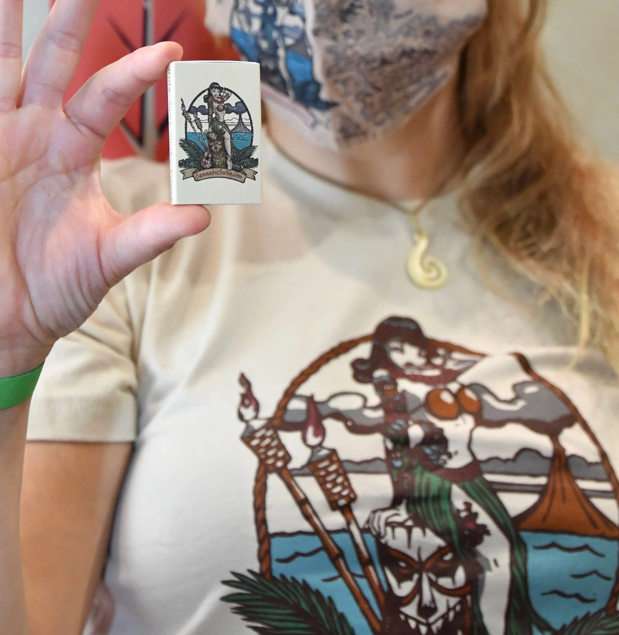 My design repeated across matchboxes, masks, and tees