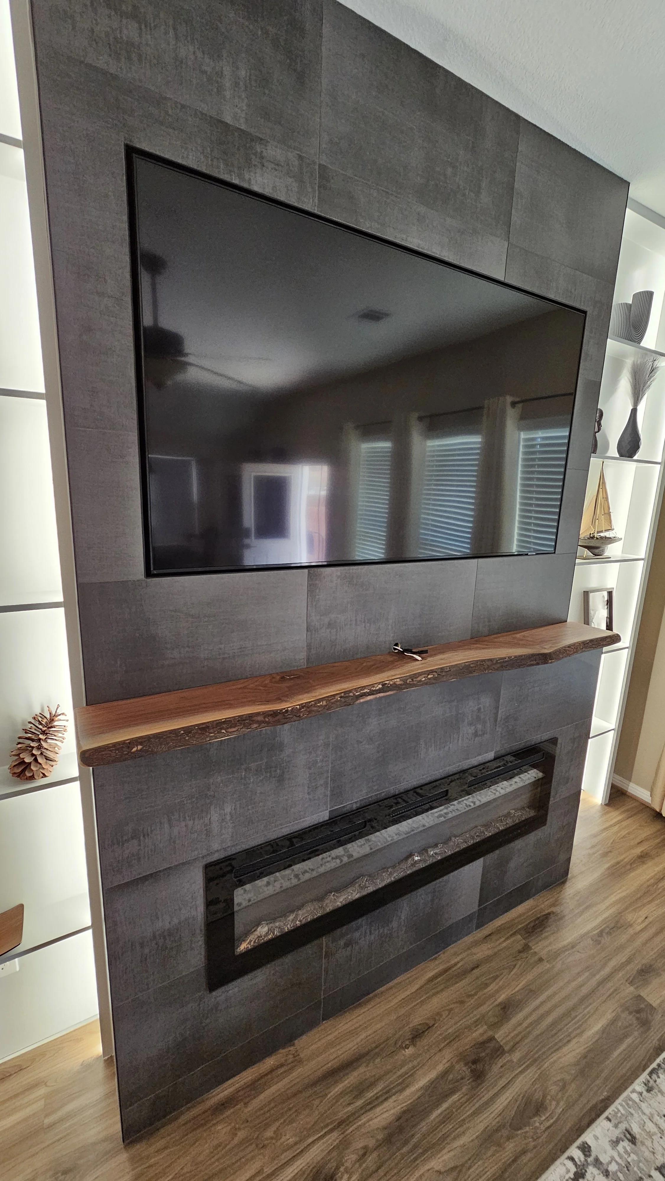 Faux fireplace with backlit shelves