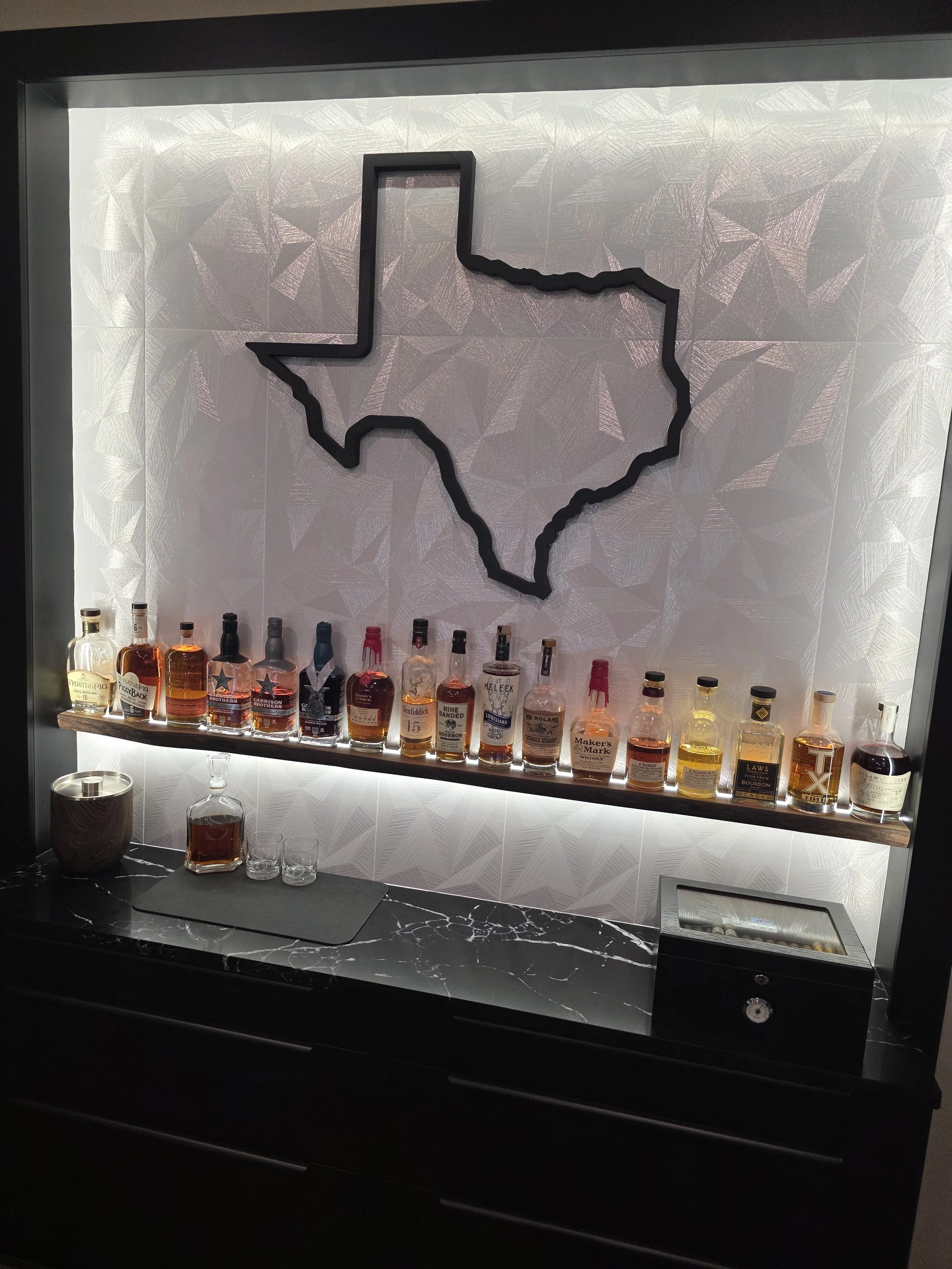 Backlit bar with drawers and live-edge shelf