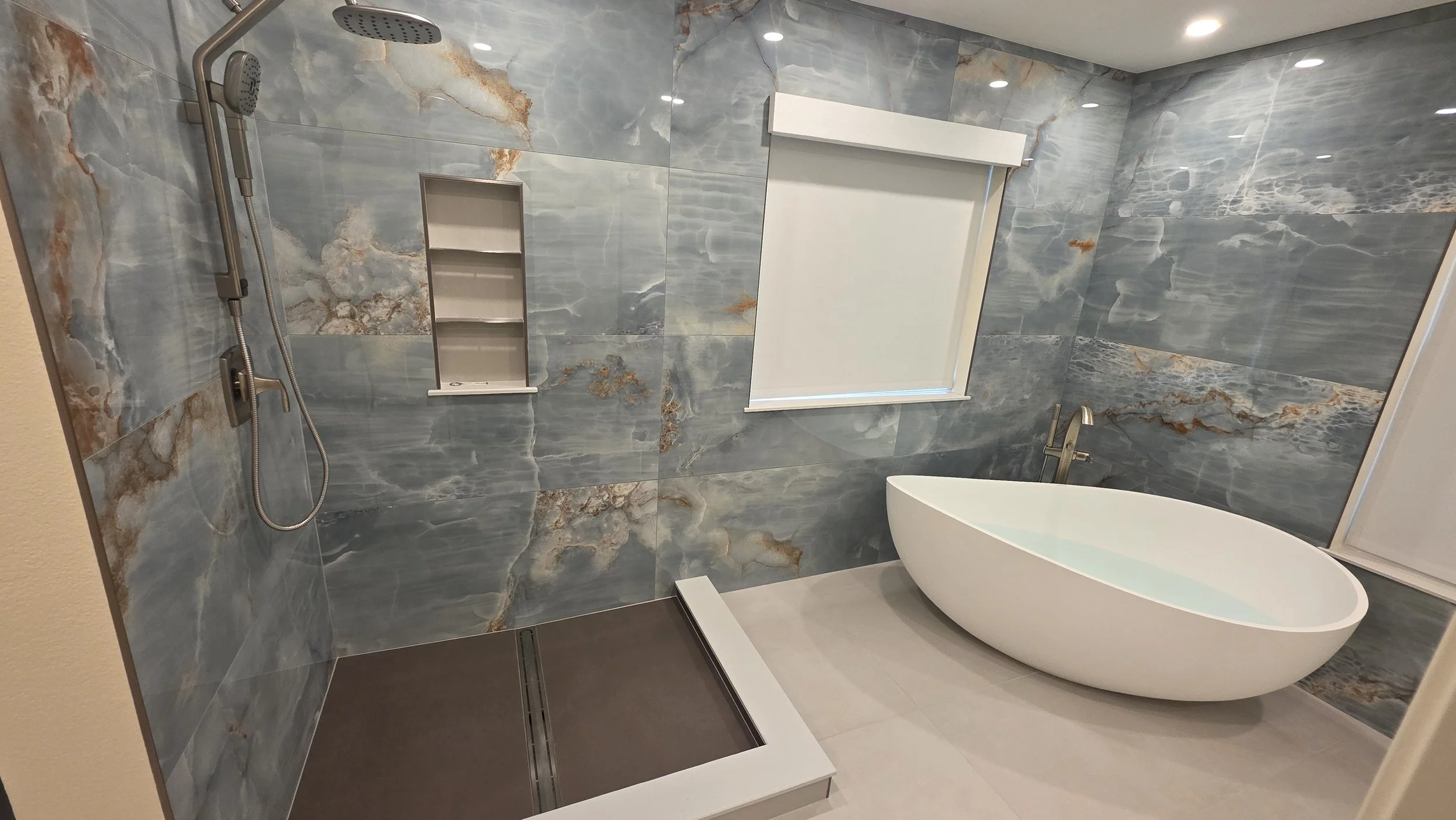 Elegant new bathroom with standalone tub