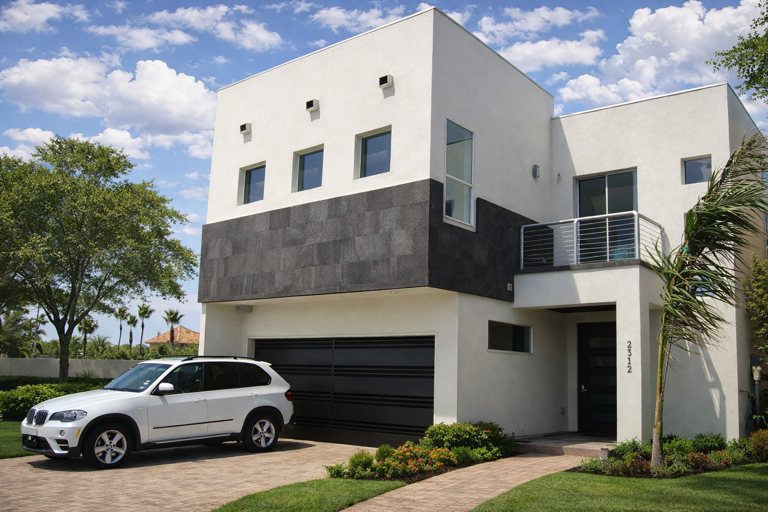 Modern white and black multi-story house with a garage, a driveway with a white SUV, landscaped yard, trees, and a clear blue sky.
