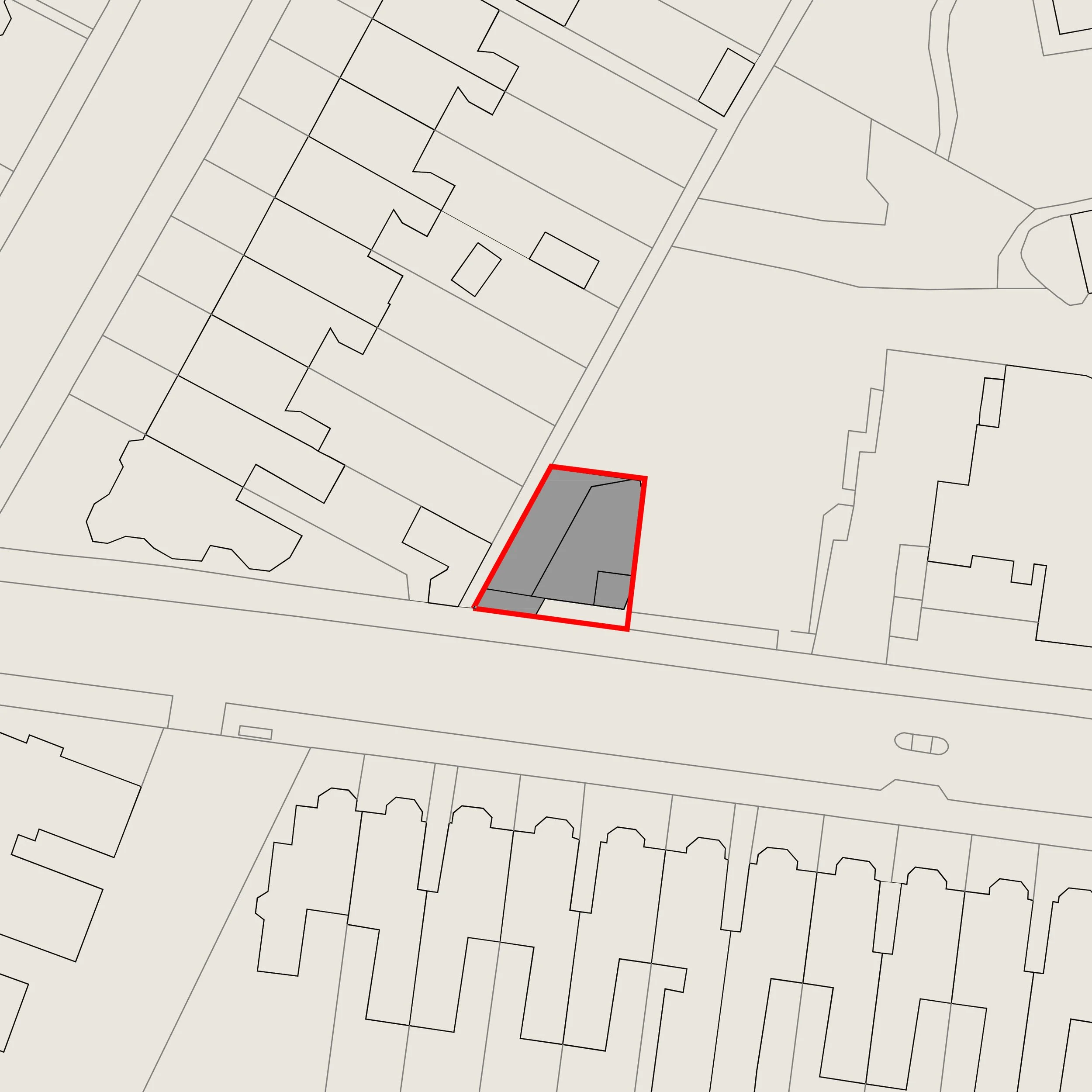 Map showing a property outlined in red, with several buildings shaded in gray, located along a street with surrounding residential buildings.
