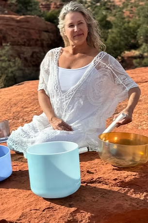 Woman practicing with singing bowls in Sedona AZ