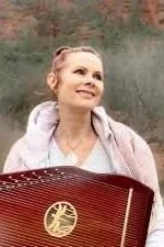 Shelly Reef holding her therapy harp