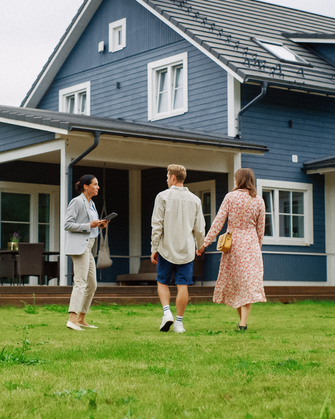 Builder walking client through completed custom home project