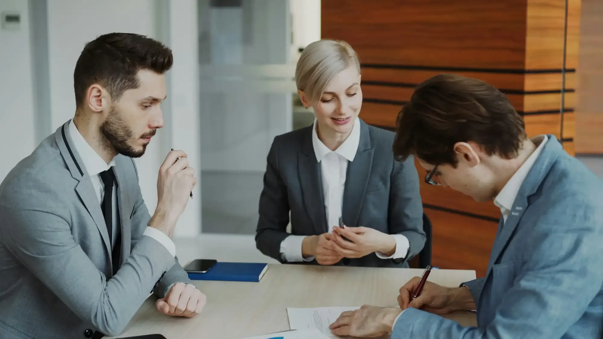 3 people meeting discussing business life insurance