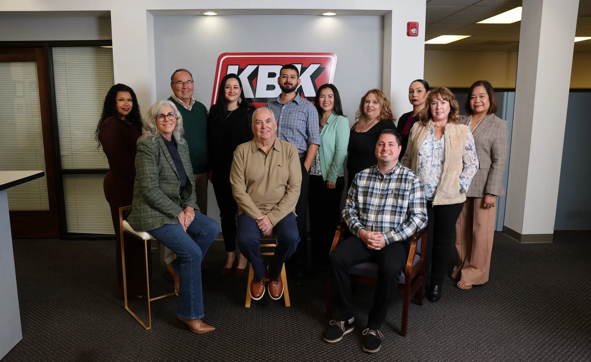 KBK Team photo in the lobby of the office