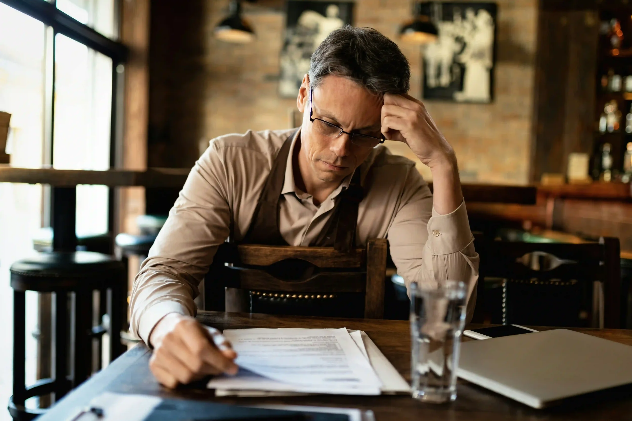 Small business owner reviewing key man life insurance policy in Watsonville California