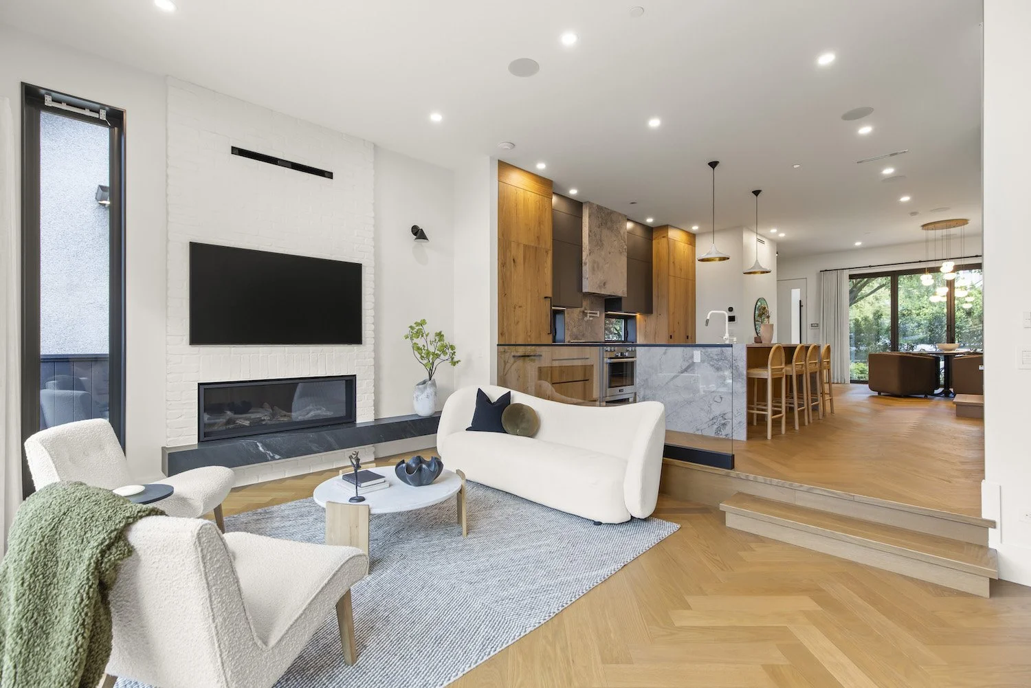 open plan living room and thoughtfully selected furnishings in a Point Grey living room.
