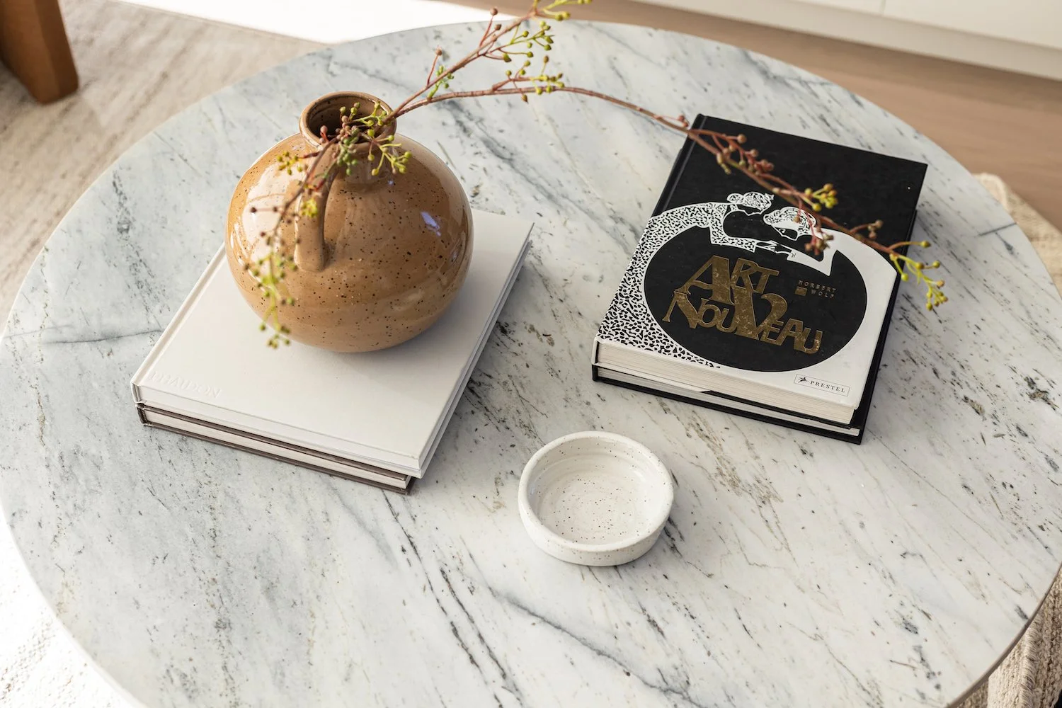 Modern coffee table styling in a Kitsilano home with curated decor and clean lines