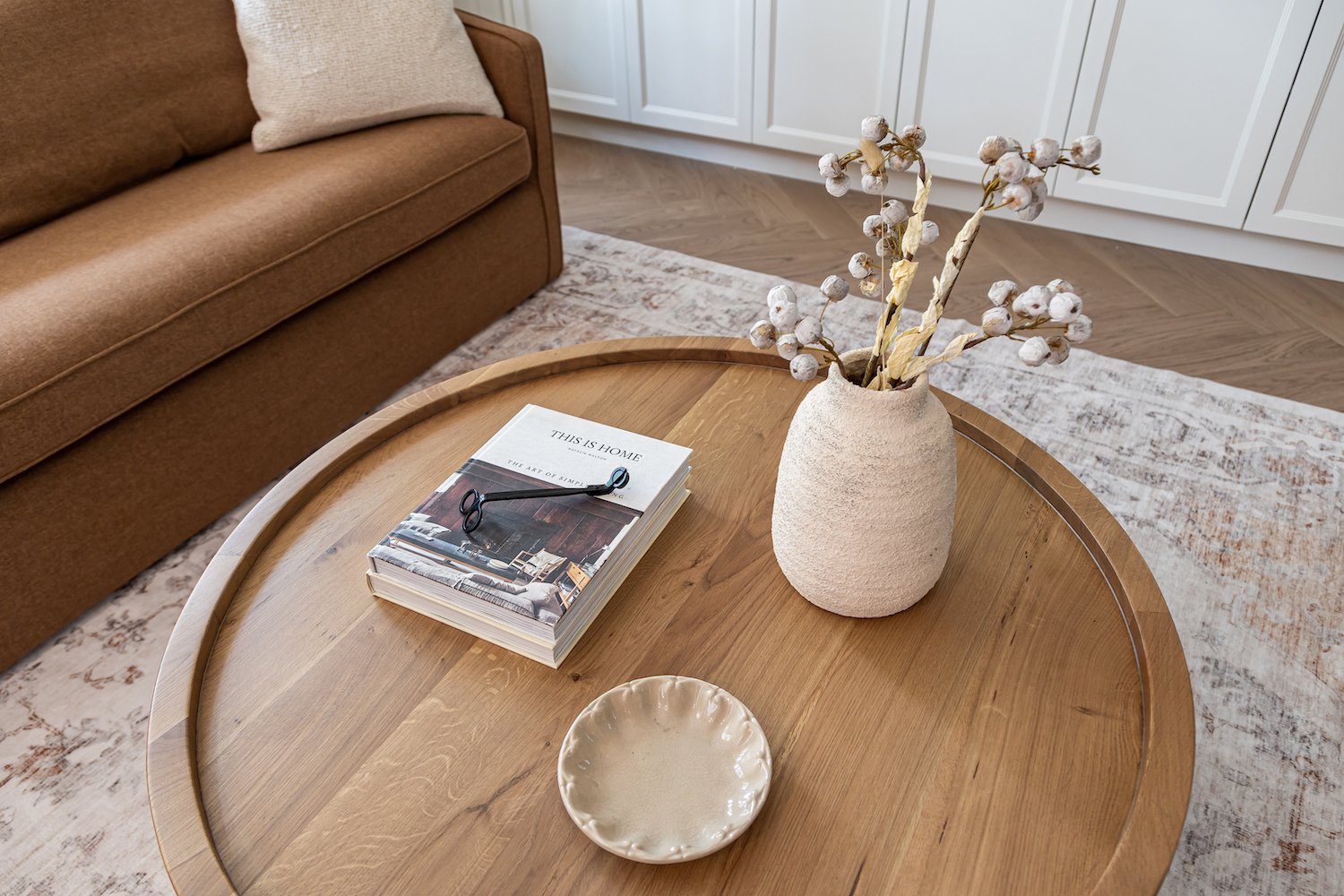 Designer coffee table styling with curated accessories in a luxury Cambie Village townhouse by The Design Alchemist.