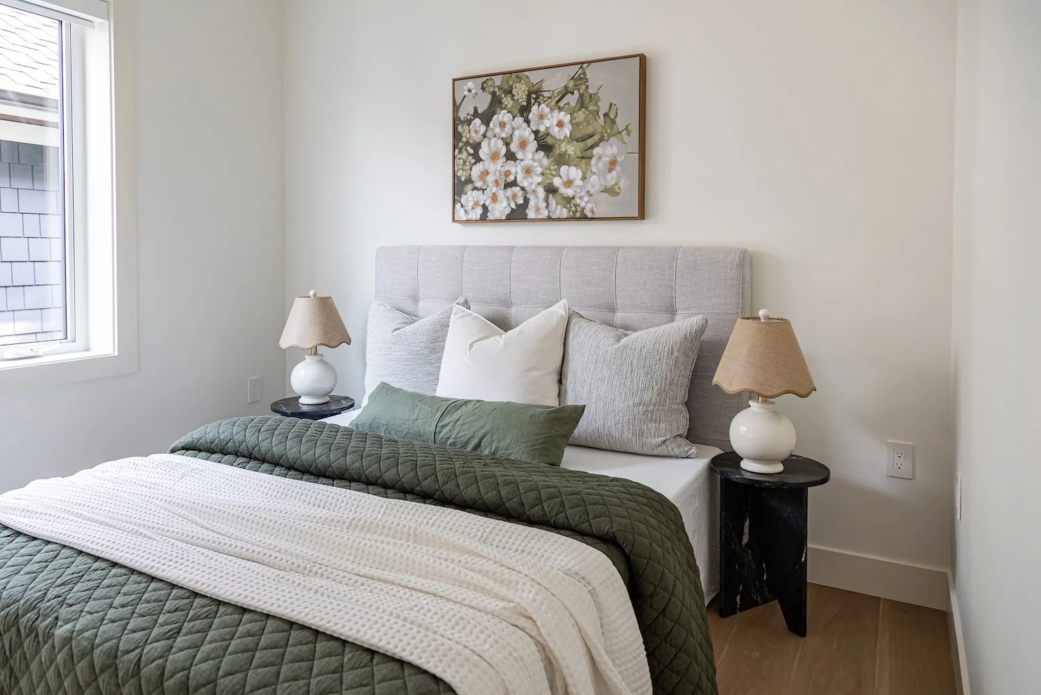 Vancouver townhouse guest bedroom featuring thoughtfully selected furniture and coordinated bedding.