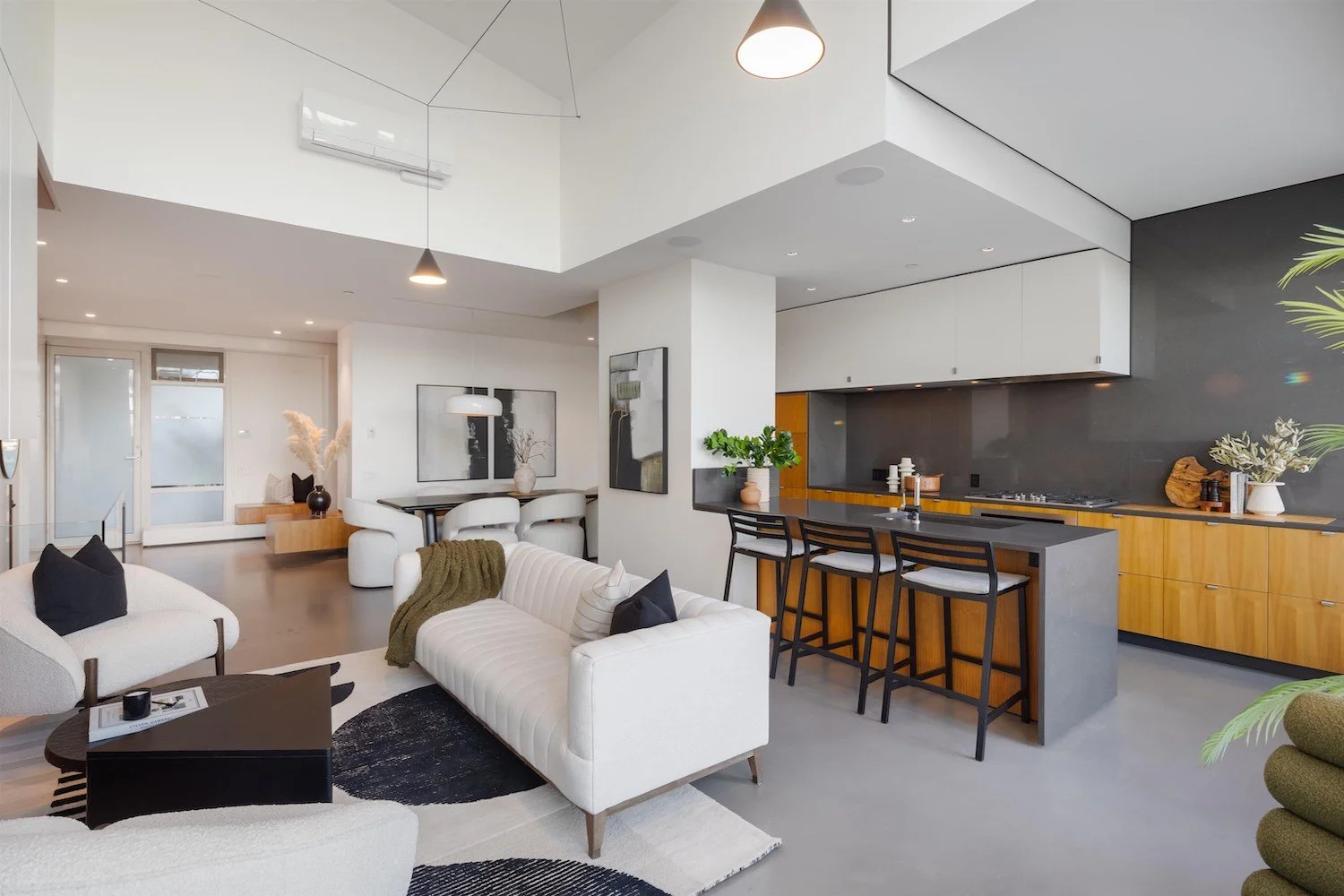 Elevated staged living room in a Vancouver luxury townhouse with refined furnishings and neutral tones