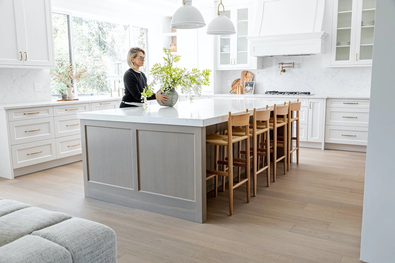 Open-concept kitchen in a Burnaby luxury home featuring modern staging and clean finishes
