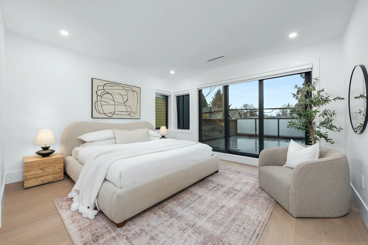 Modern primary bedroom in a Kitsilano duplex with efined styling