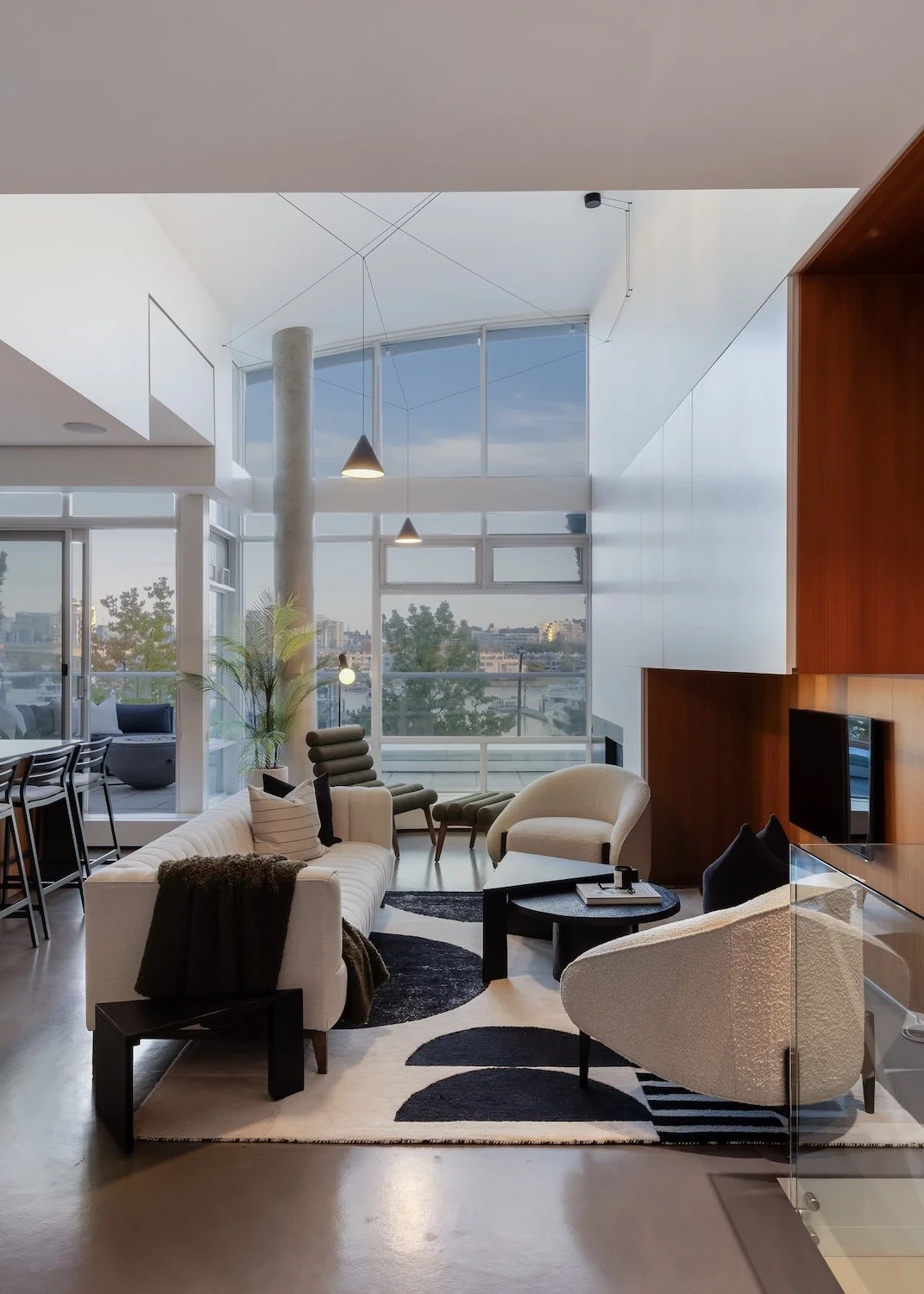 Warm and inviting family room in a Vancouver luxury townhouse with comfortable staged seating
