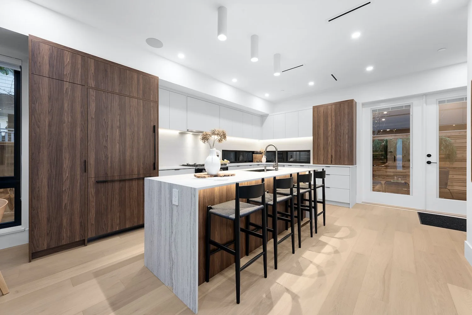Open-concept kitchen in a Kitsilano duplex with modern finishes