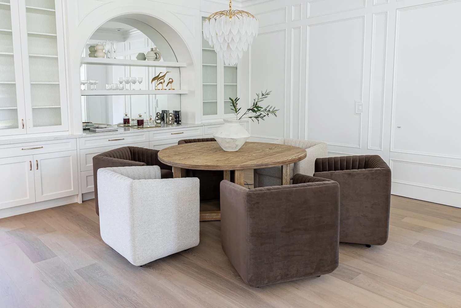 Contemporary dining room in a Burnaby luxury home with elegant staged seating and clean lines