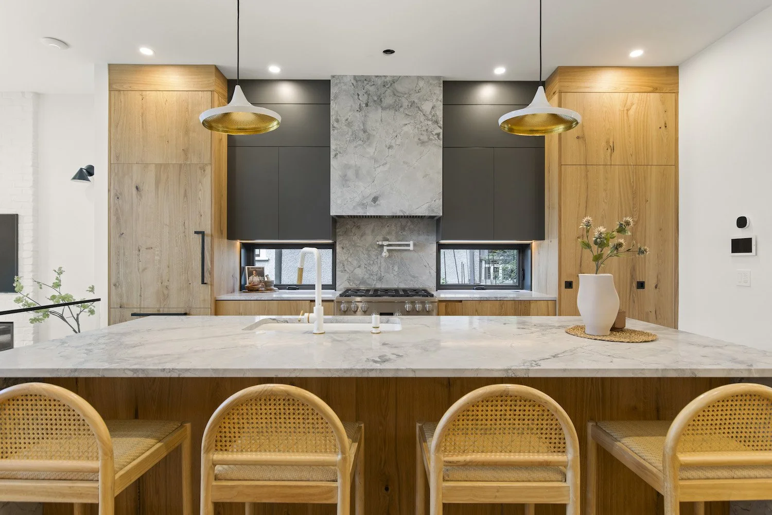 Kitchen island styled with carefully selected accessories in a Point Grey home.
