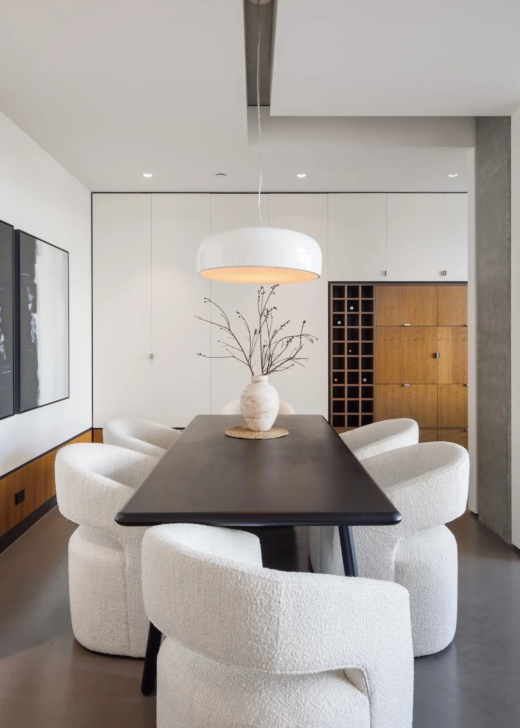 Contemporary dining room in a Vancouver luxury townhouse with elegant table styling and clean lines