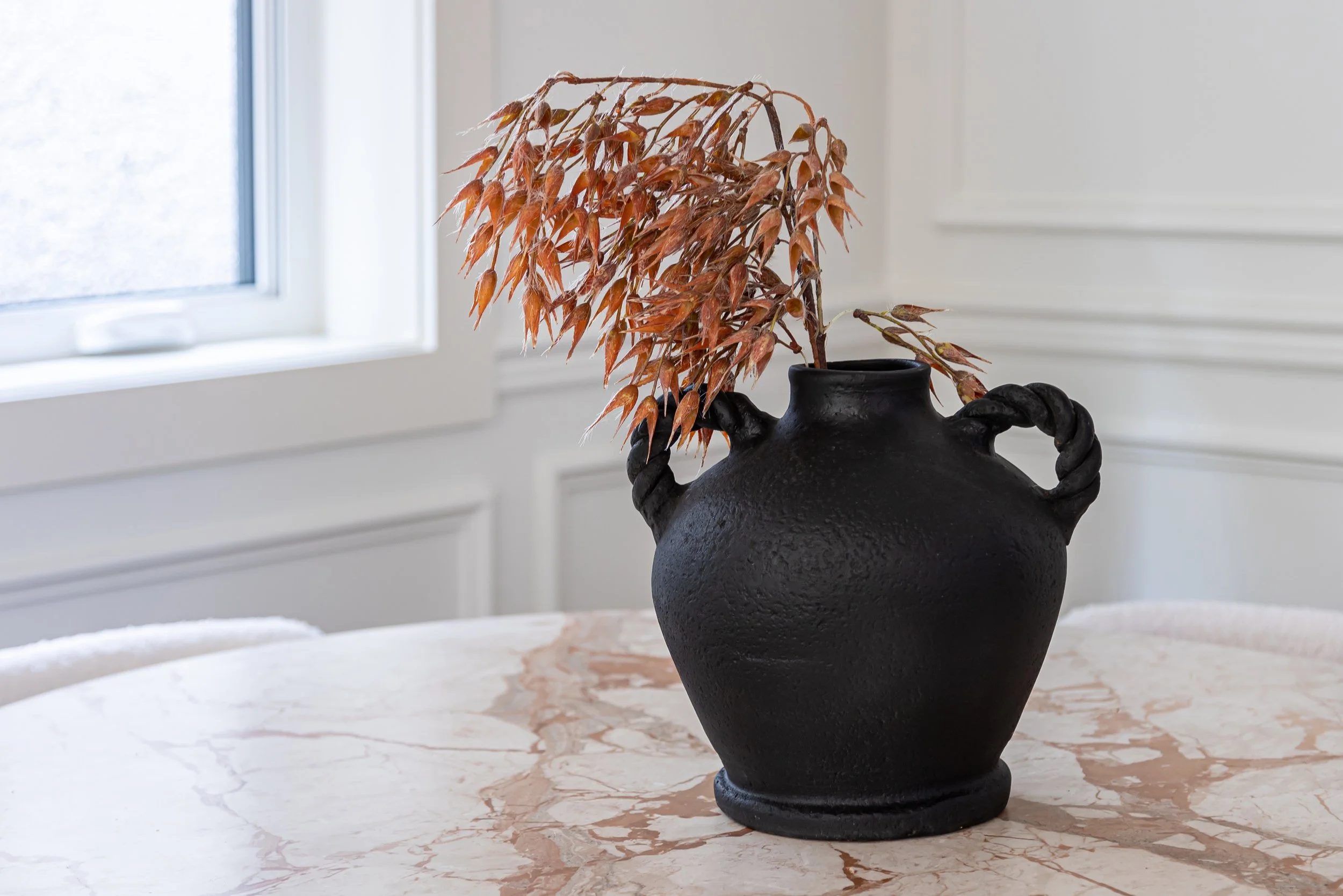 Close-up of decorative accessories and dinning table styling in a luxury Cambie Village townhouse by The Design Alchemist.