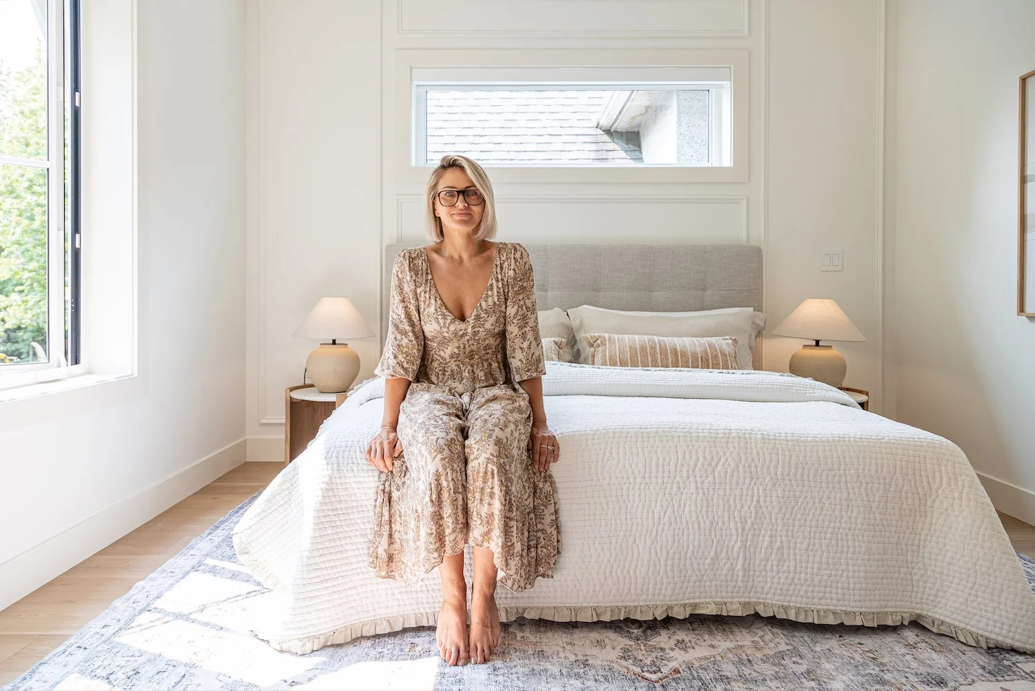 Professionally staged primary bedroom featuring soft textures and a calm, neutral colour palette.