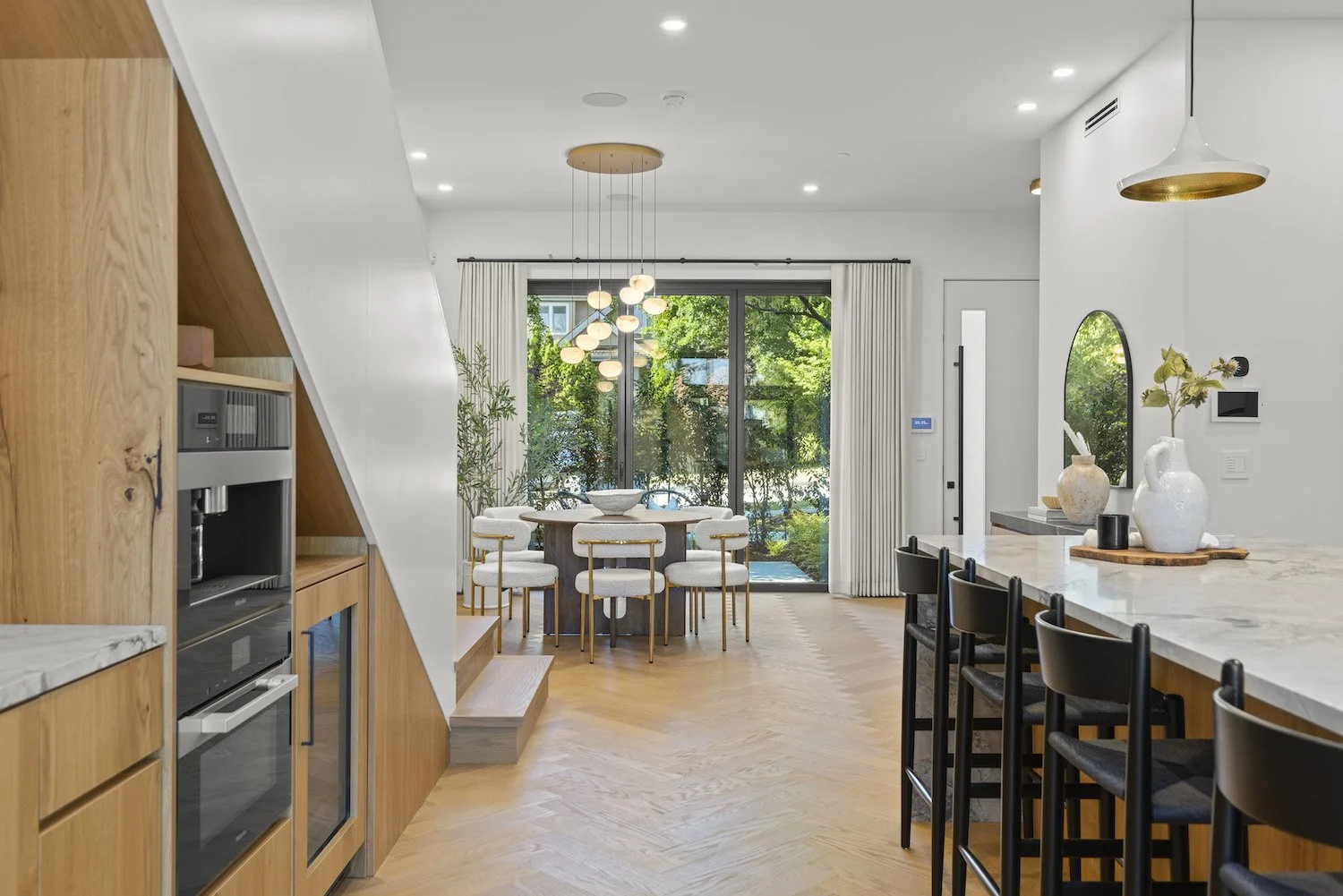 Open-plan dining area showcasing the interior styling of a luxury Vancouver duplex.