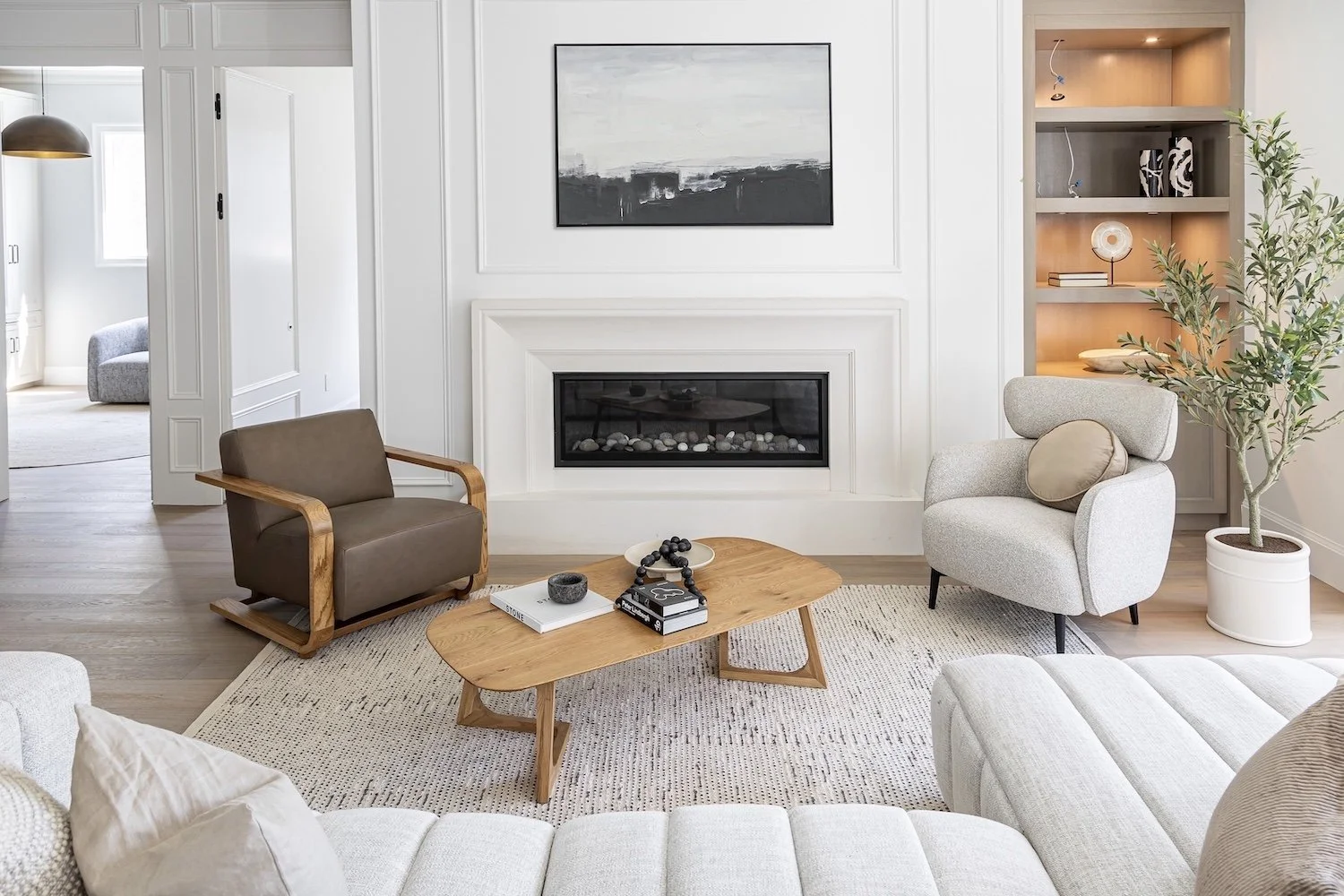 Warm and inviting family room in a Burnaby luxury home with comfortable staged seating