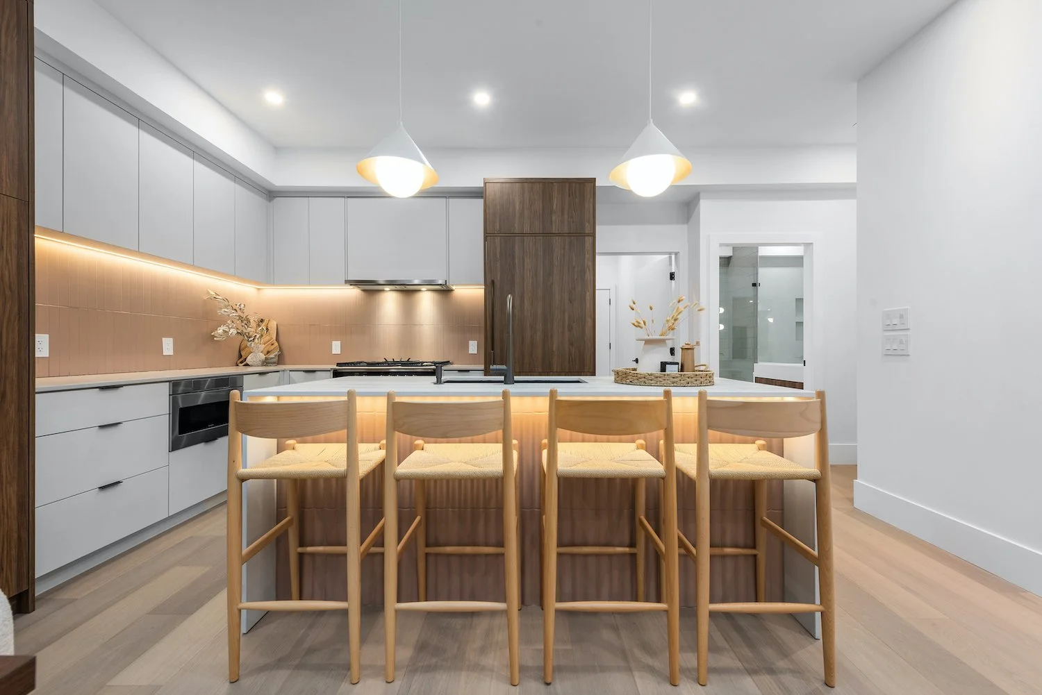 Open concept kitchen in a Kitsilano home with a functional layout