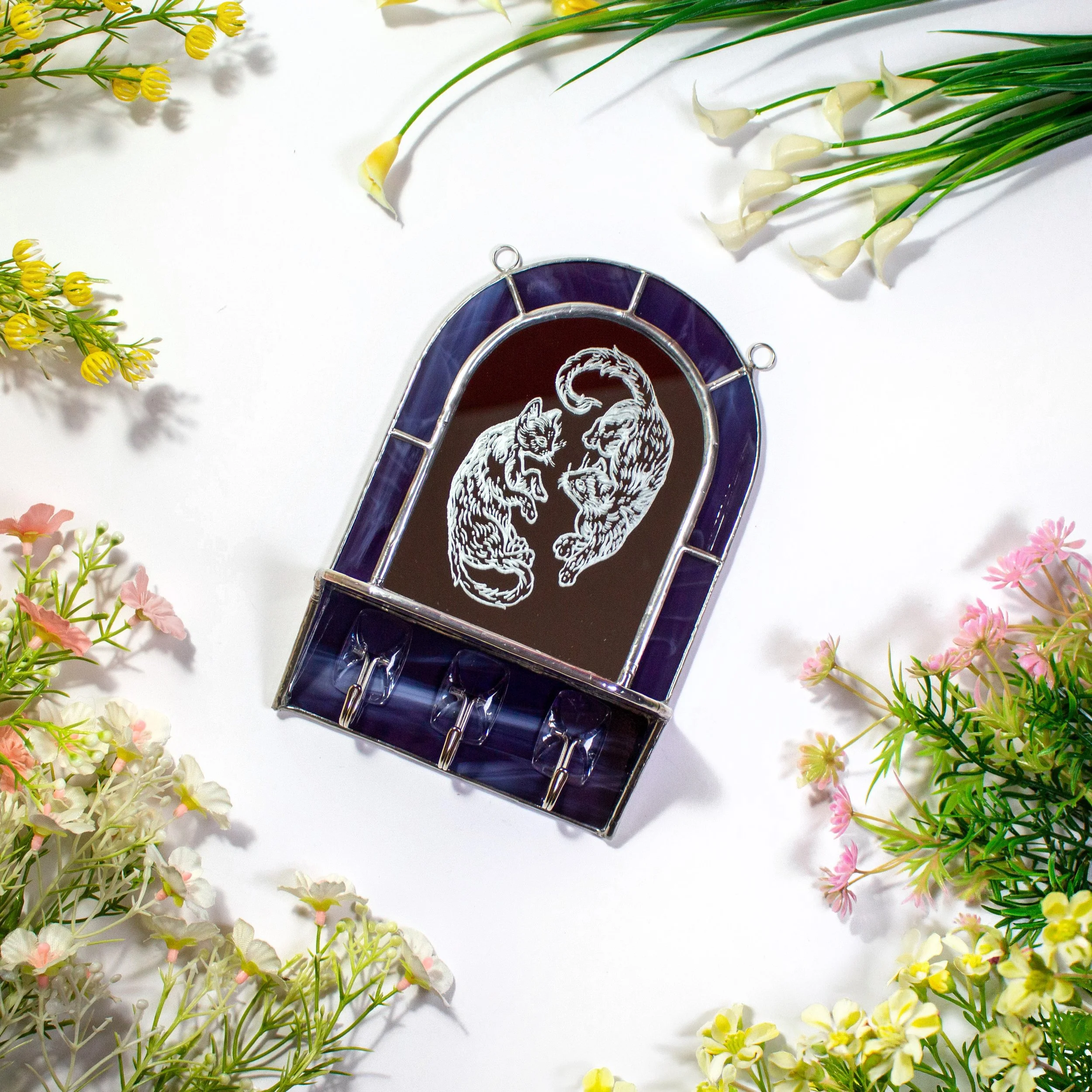 Meet my newest handmade creation 🐈💜

This stained glass mirror shelf is designed to be both beautiful and practical. Featuring a hand-engraved mirror with two cats, a shelf for your favourite little treasures, and hooks for necklaces, bracelets, or