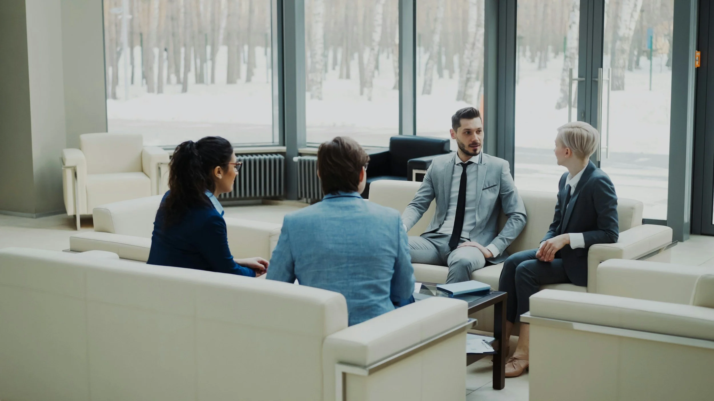 Founder and leadership team working together in an established service business.