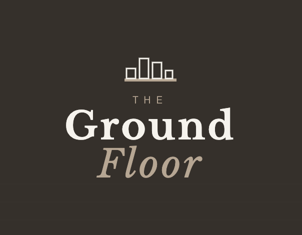 Logo with building silhouette above the text 'The Ground Floor' in large and stylized fonts.