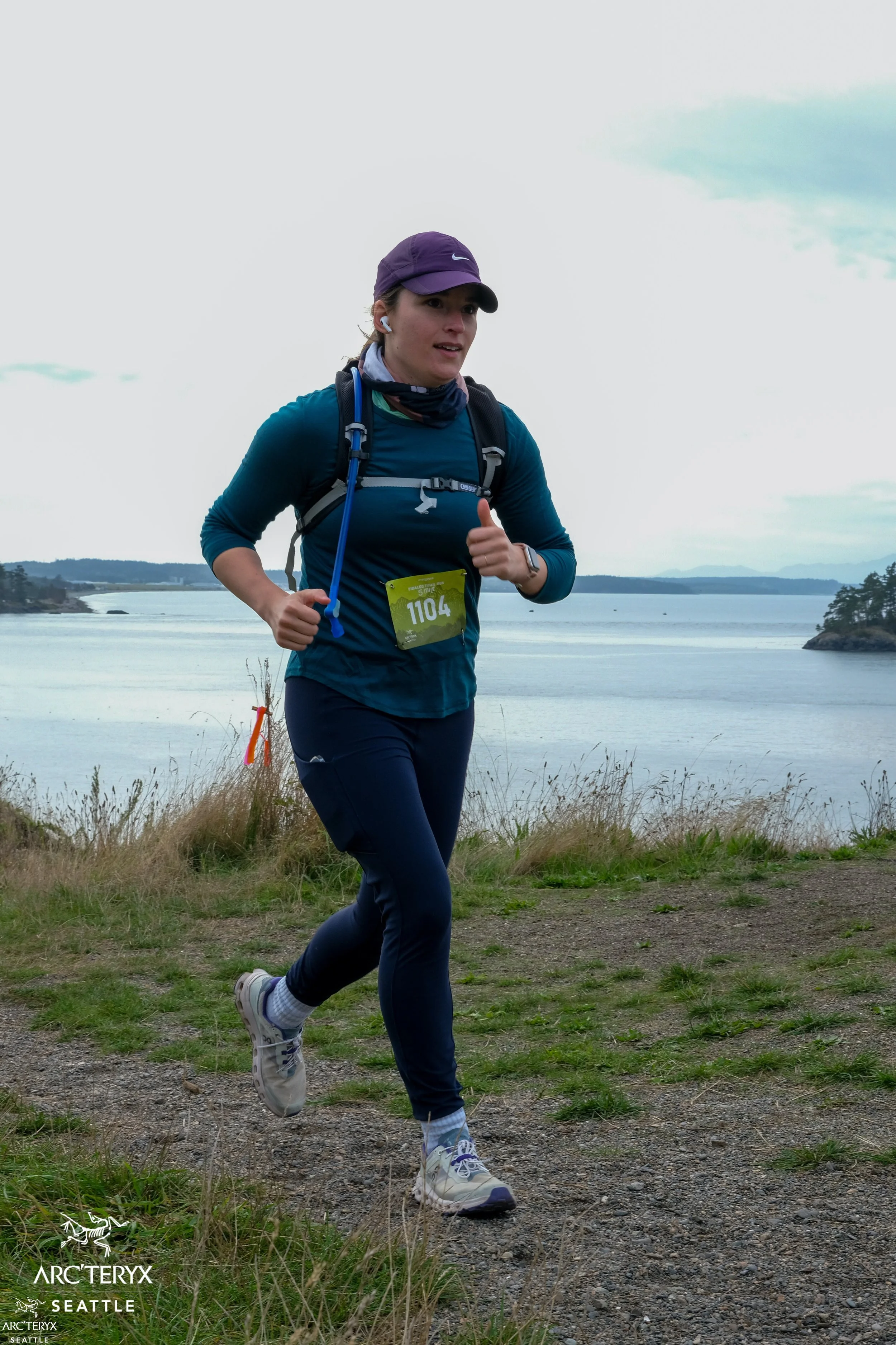 Sophia running a race with an ocean backdrop