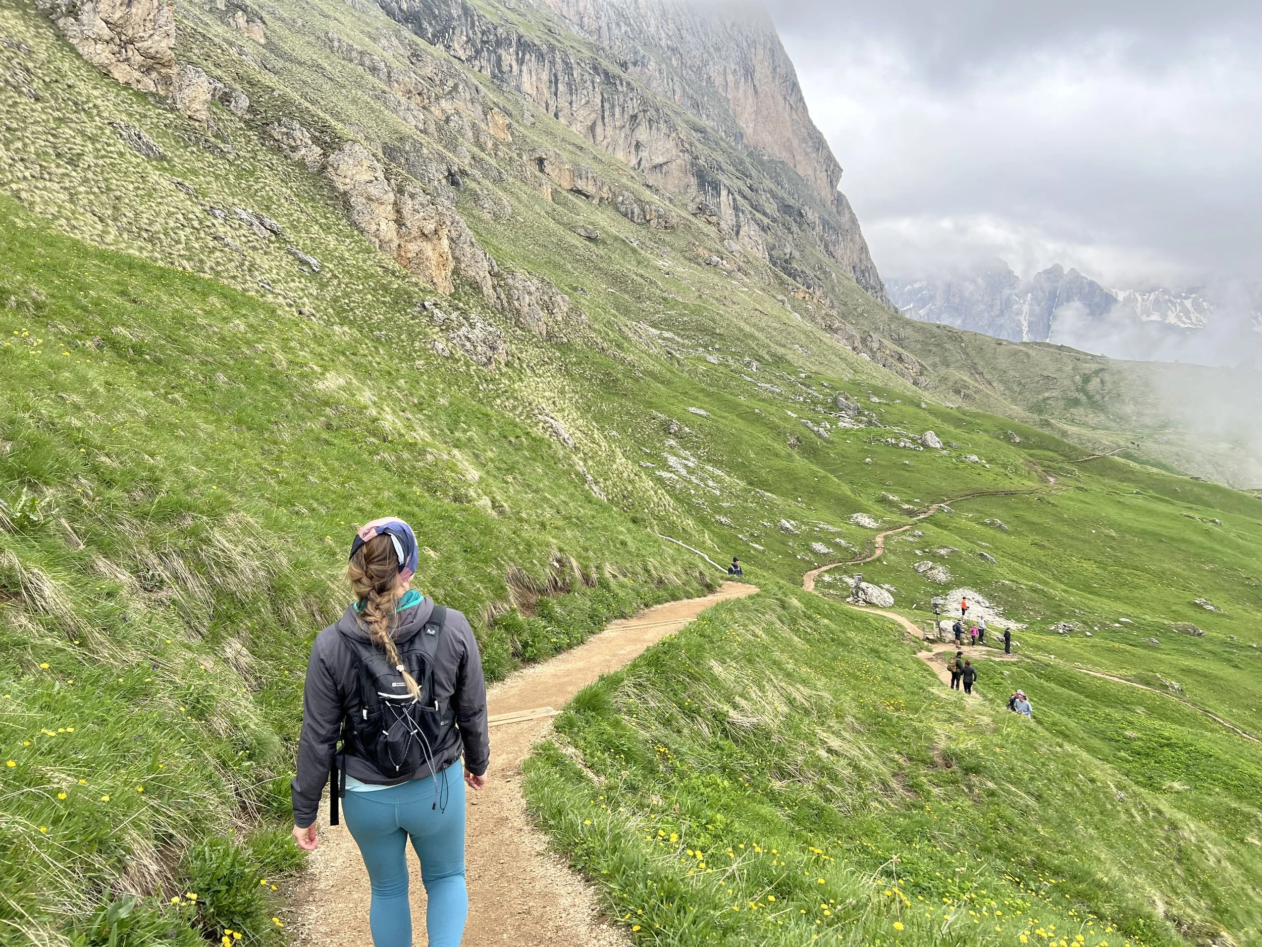 Sophia walking along a mountainous trail