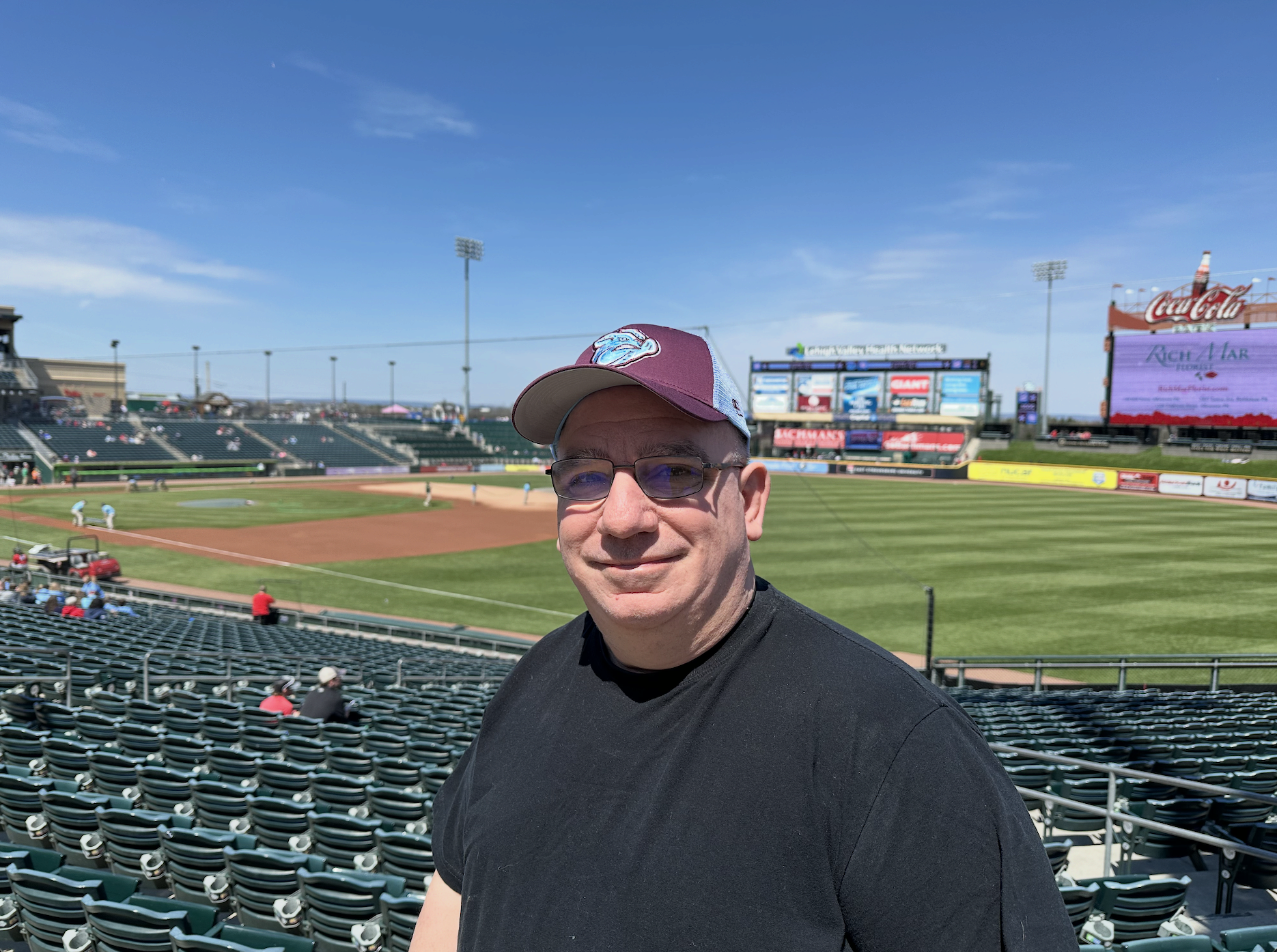 Image of Frank in front of a baseball field