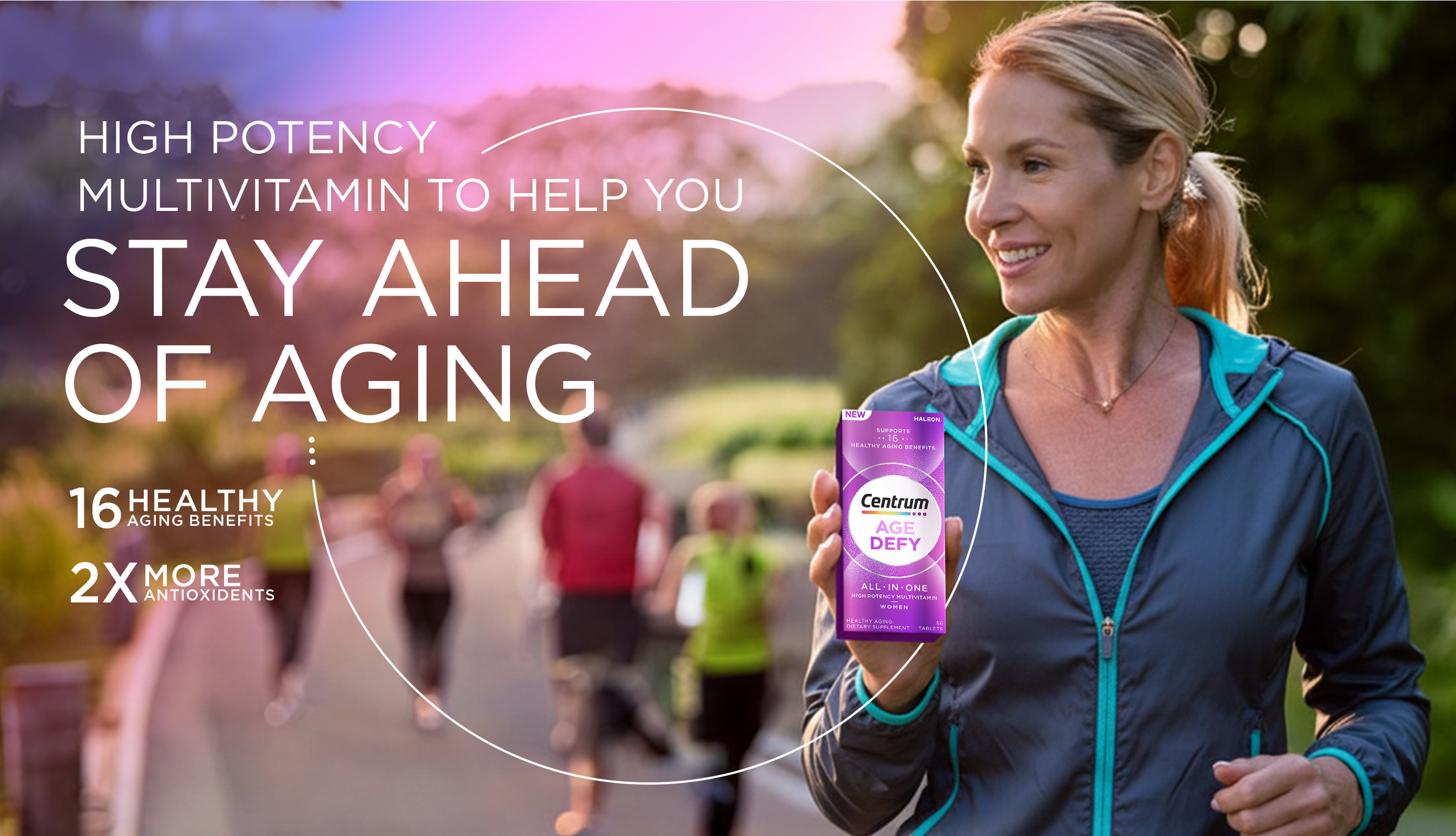 A woman running outdoors holds a purple box of Centrum Age Defy multivitamins, smiling as other runners pass by in the background, with a sunny and green park setting.