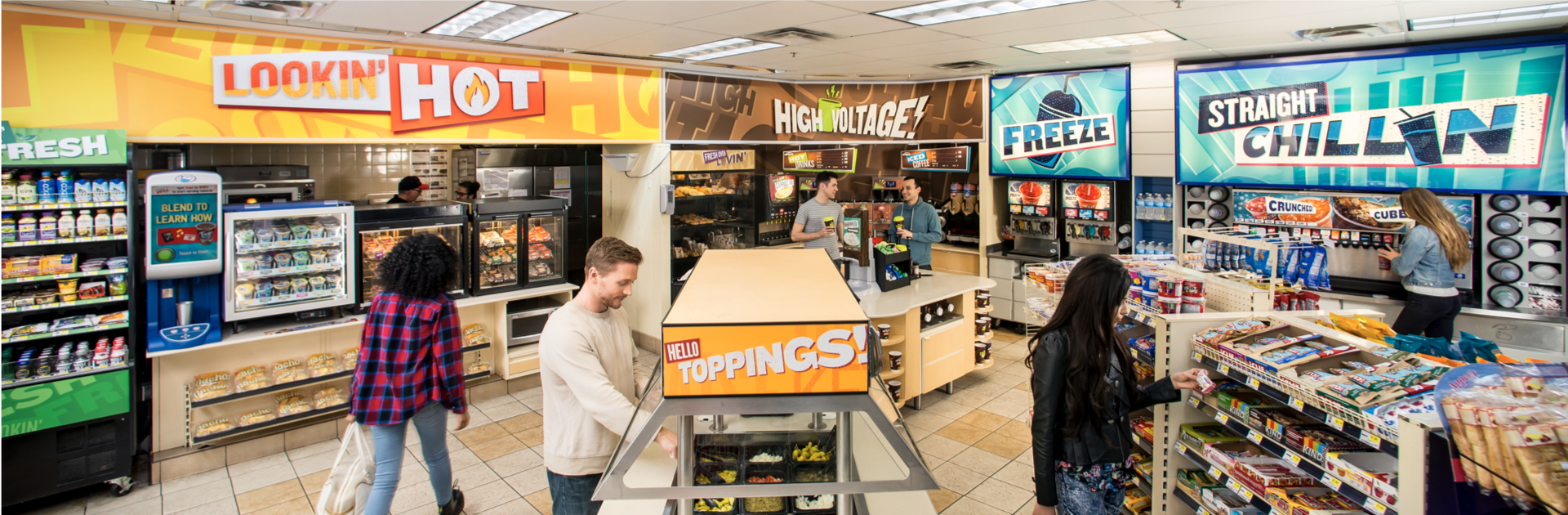 Inside a convenience store with self-serve food and snack stations, featuring signs like 'LOOKIN' HOT', 'HIGH VOLTAGE', 'FREEZE', and 'STRAIGHT CHILLYN', with a few customers shopping and interacting.