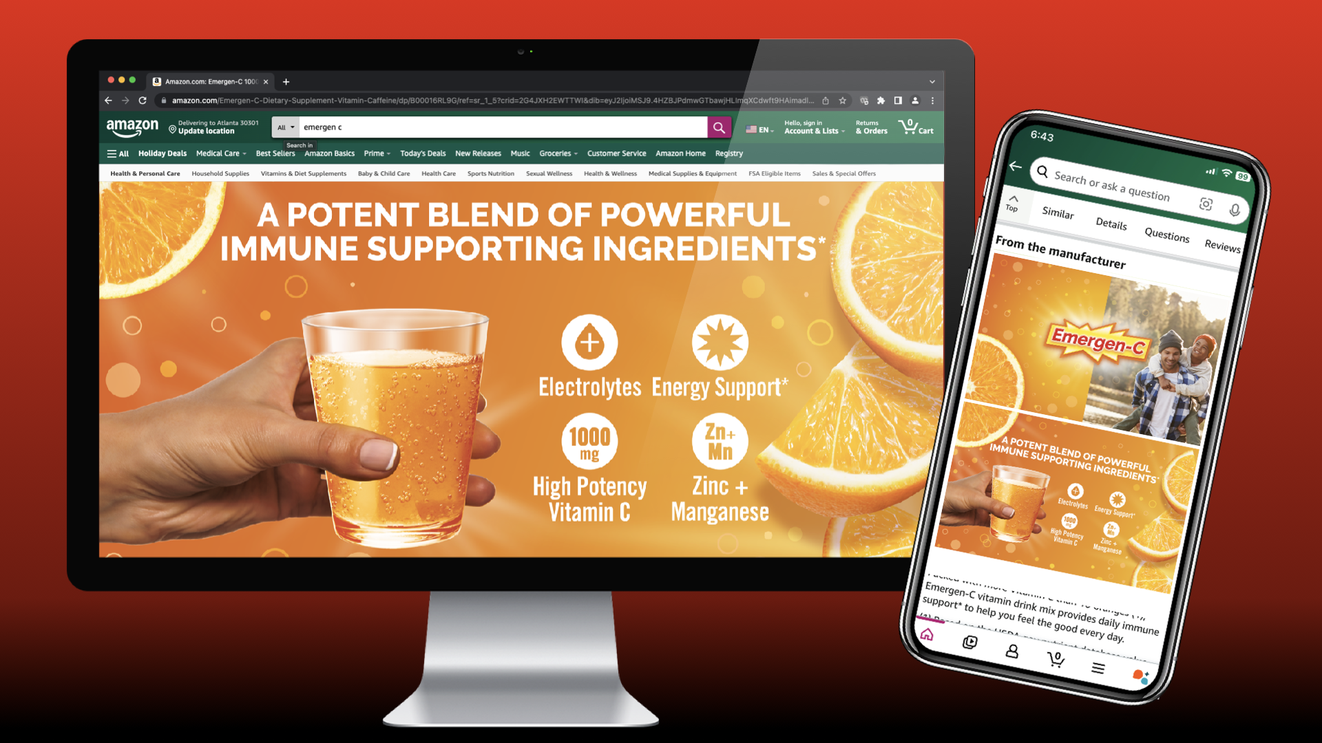 A computer monitor displaying an orange-themed advertisement for a vitamin drink with ingredients like electrolytes, energy support, high potency vitamin C, zinc, and manganese, featuring images of orange slices and a person's hand holding a glass of orange beverage. A smartphone shows a product image with similar orange-themed visuals and the brand name 'Emergen-C'.