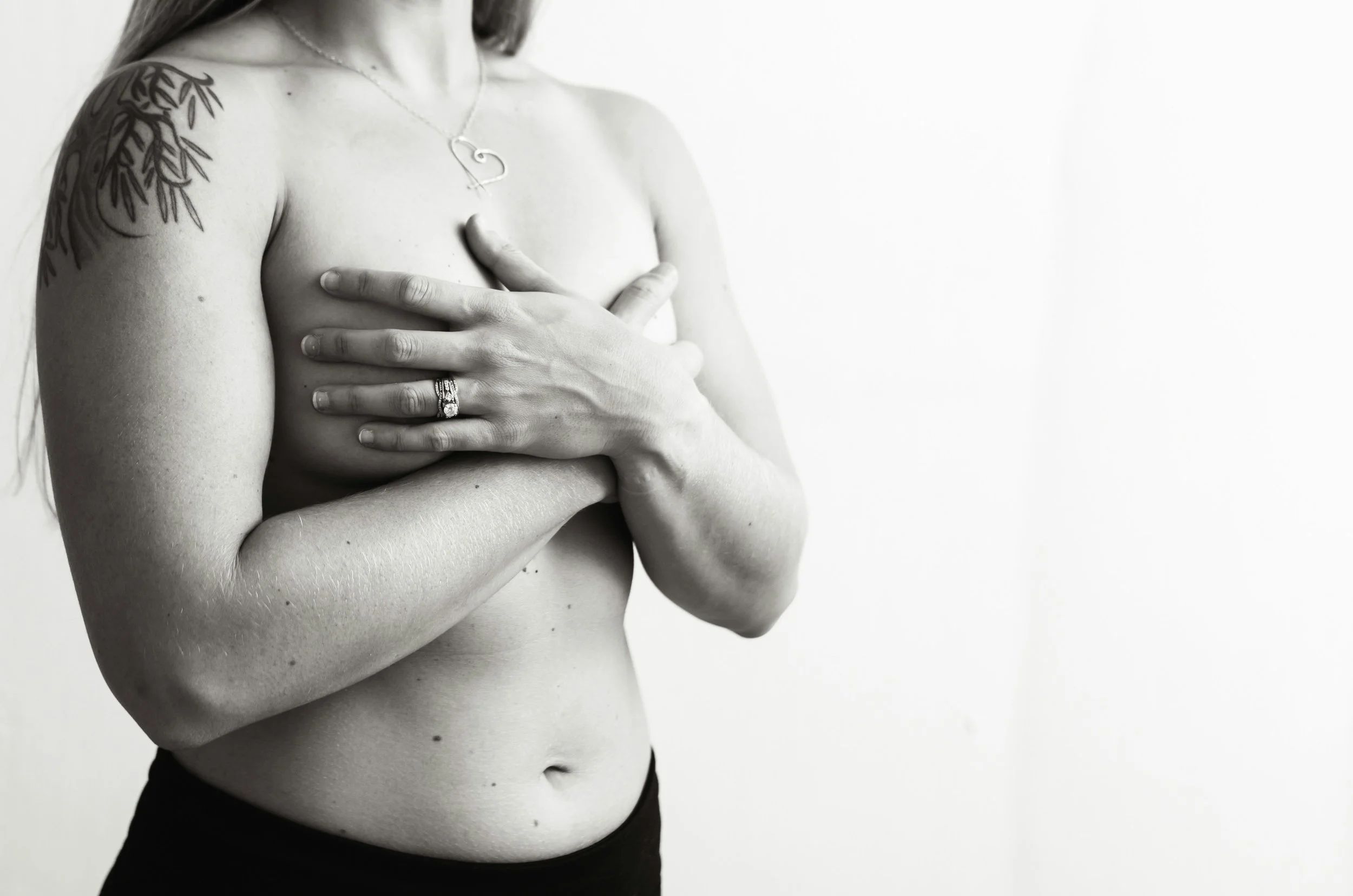 Woman holding her chest during breast cancer
