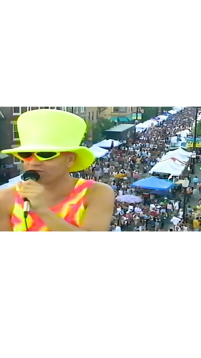 JOHN WORKING AS A REPORTER FOR "REEL GAY NEWS"