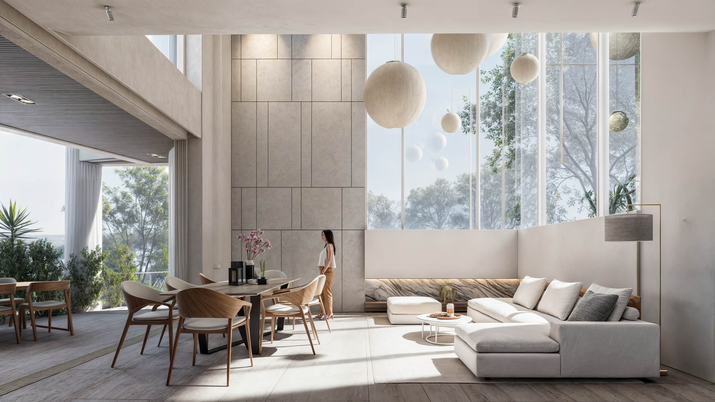Modern living room with large floor-to-ceiling windows, white sofa, wooden dining table with chairs, decorative light fixtures, indoor plants, and a woman standing near the wall.