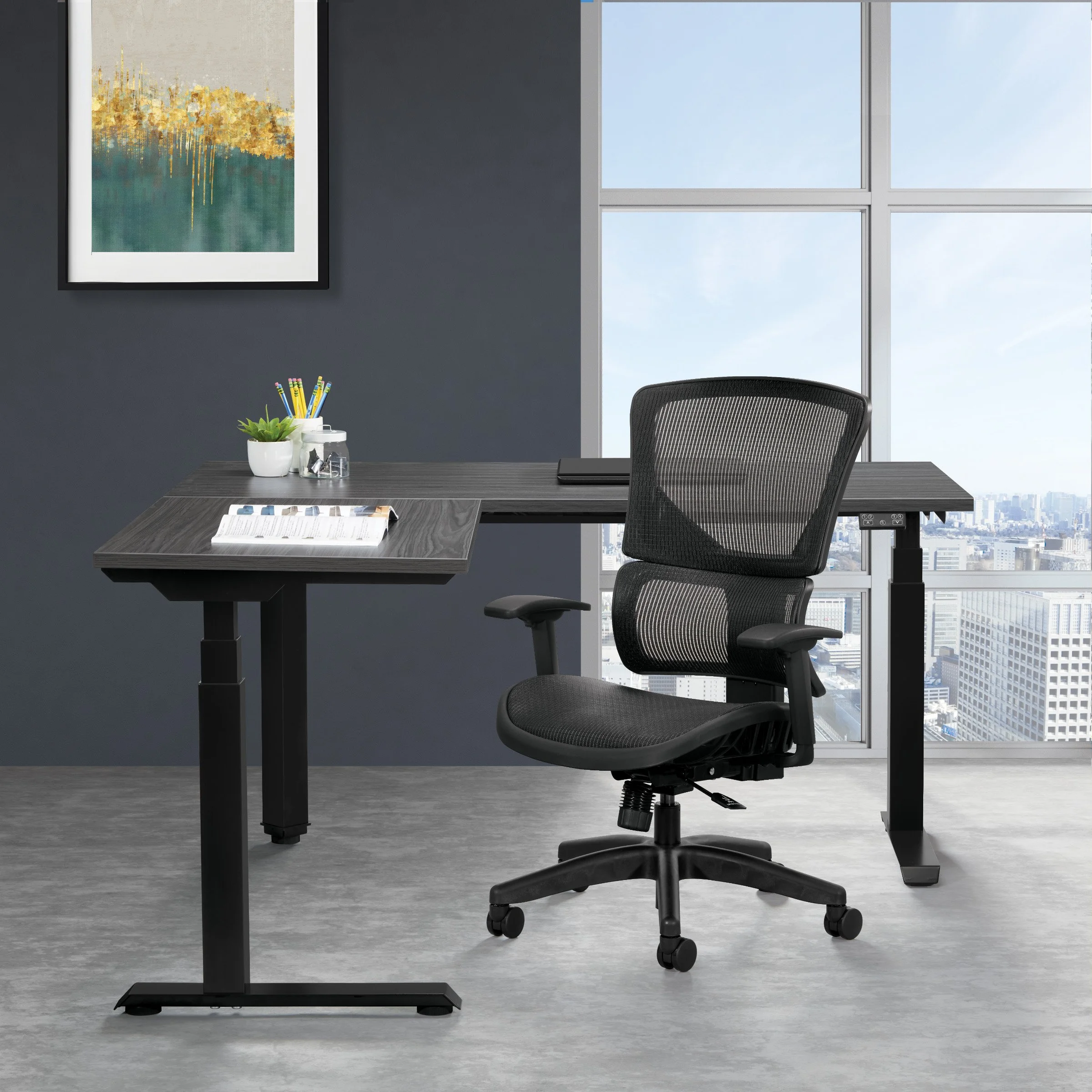 An empty modern office workspace with a black ergonomic chair, a gray desk with a white plant, a container of pens, and a opened book, situated in front of large windows overlooking a city skyline.
