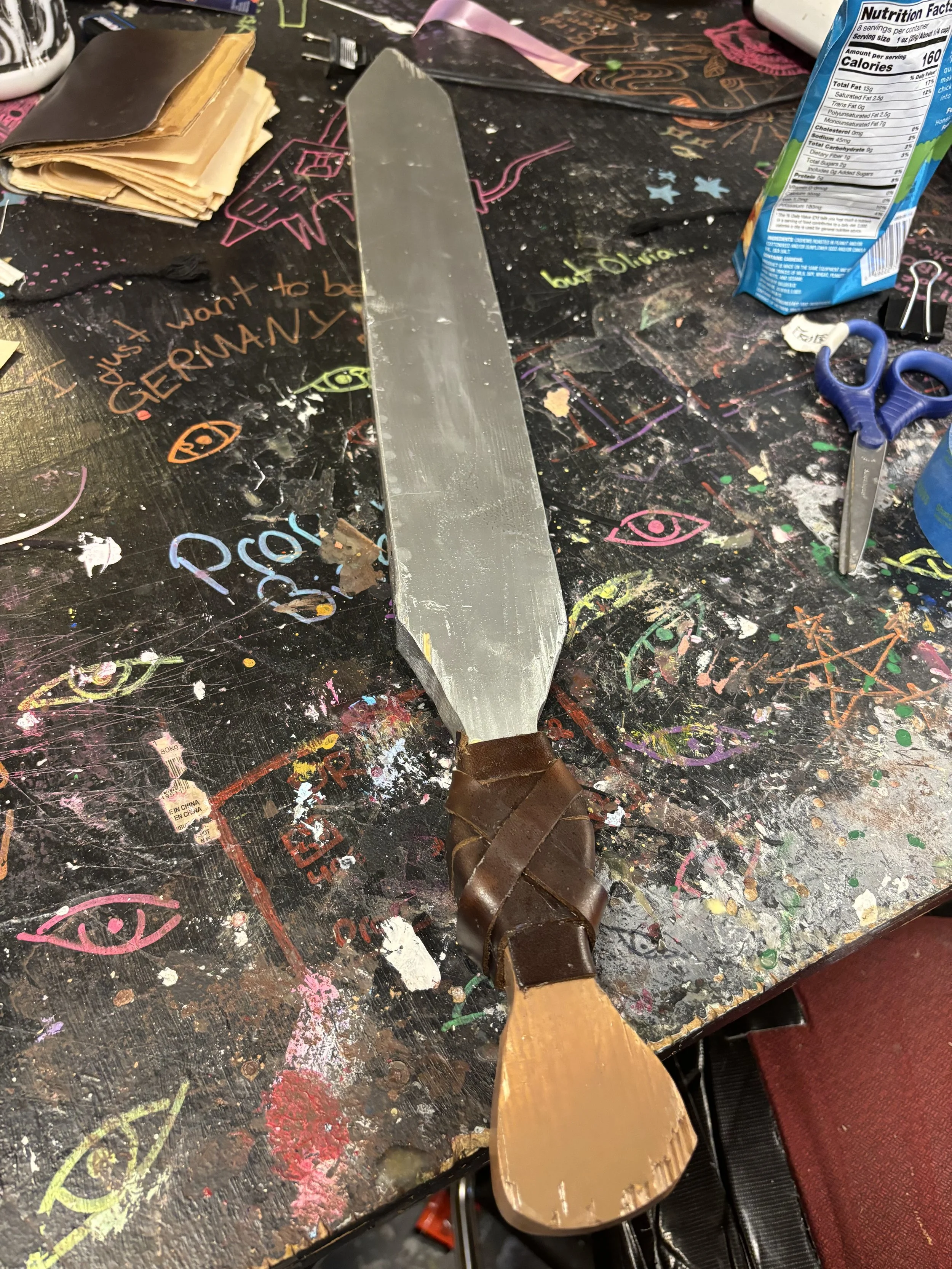 Sword (Complete), "(Anon)ymous," Dir. Dr. Cecilia J. Pang, made with wood, spray paint, and leather