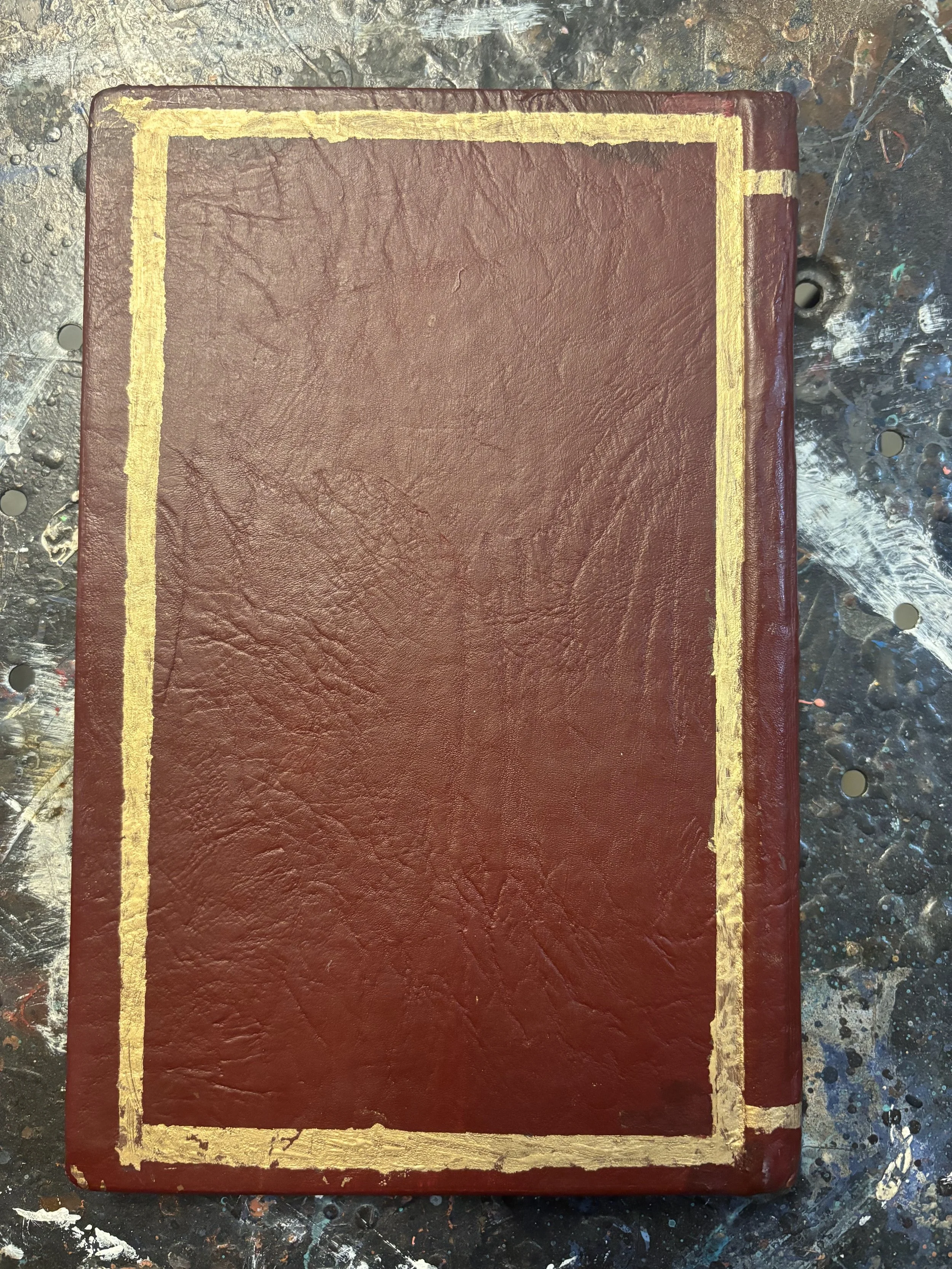 Page’s Journal (in progress-back), made with leather notebook, acrylic paint, and paint pen