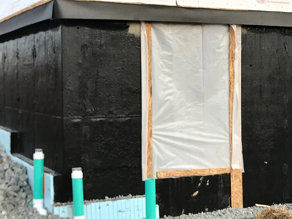 Foundation waterproofing system with expandable tar and 1” styrofoam