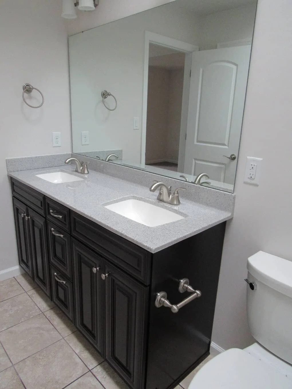 Custom cut bathroom mirrors above vanities, towel bars and towel ring