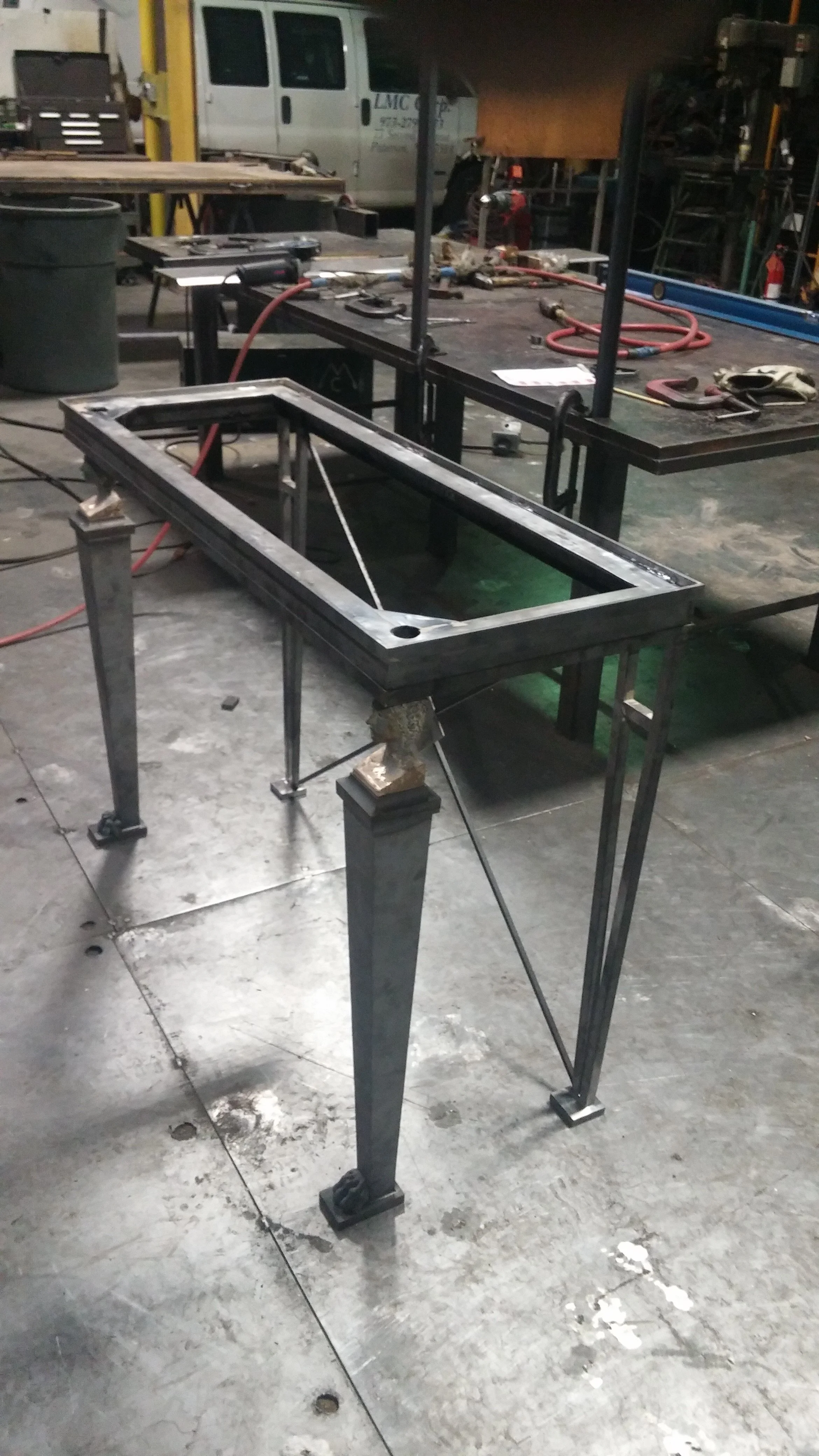 Table Base - forged and fabricated table base, custom sculpted and cast French heads and lion's feet. NYC