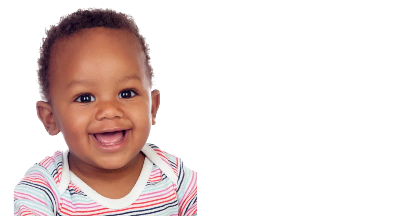 Close-up of a smiling toddler with curly hair wearing a striped shirt.